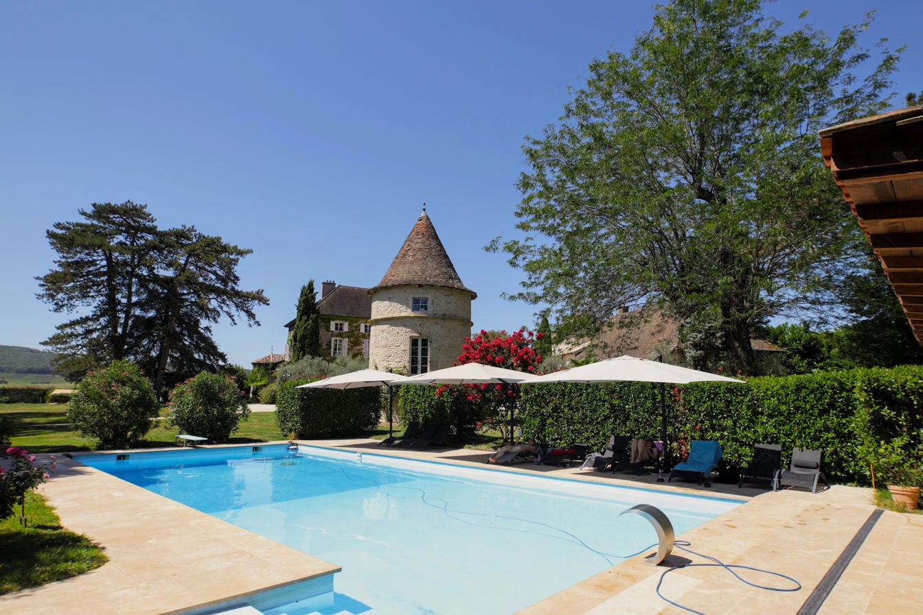 The pool, the tower and the parkland beyond on a clear summer day.