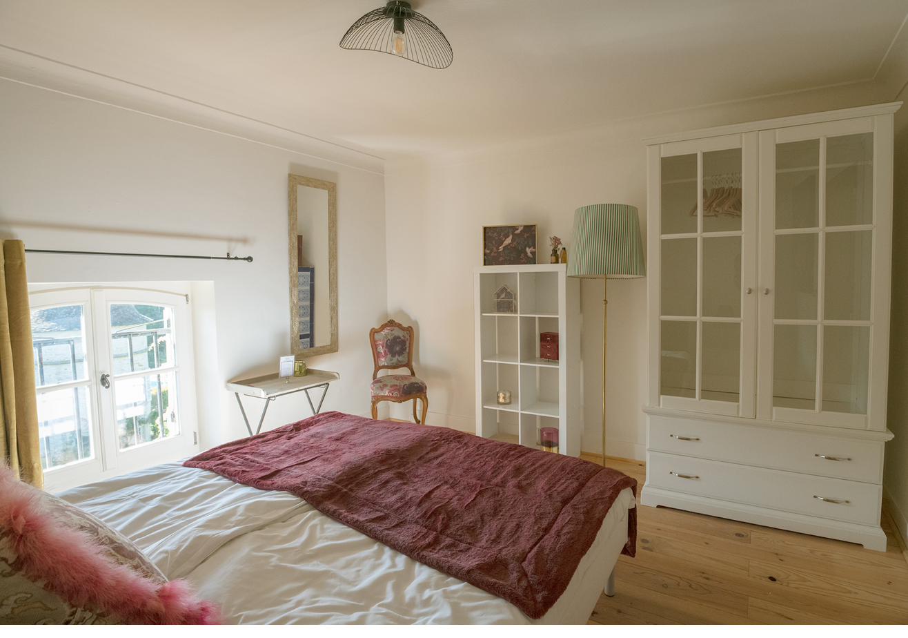 Chambre Grise — the second top-floor room, tucked beneath the original roof beams.