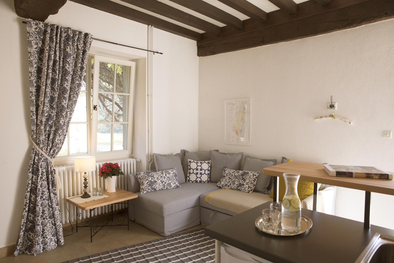 The beamed sitting room of the Diane apartment.